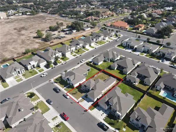an aerial view of a city with streets and houses