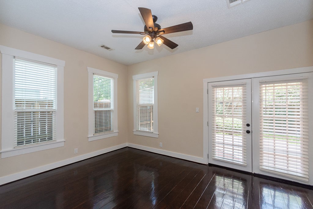 3909 Barnes Street Houston, TX 77007 - Photo 15 of 22 Large second bedroom with beautiful floors. Tons of windows give this room amazing light