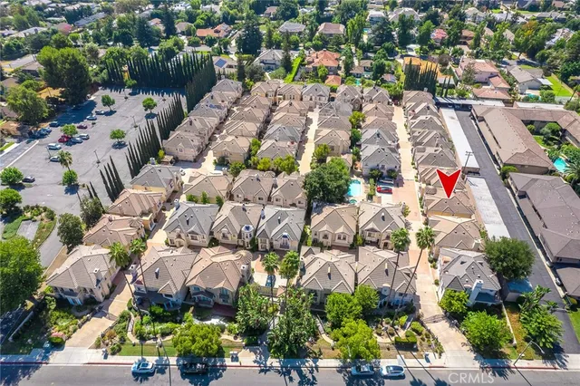 an aerial view of residential houses with outdoor space