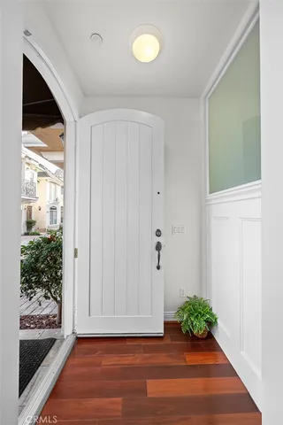 a view of room with window and wooden floor