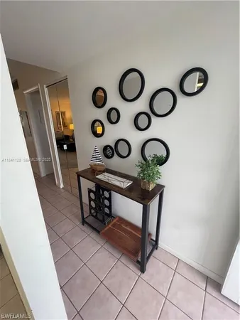 a view of entryway with furniture and front door