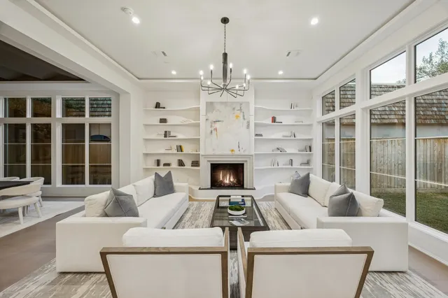 a living room with furniture a window and a fireplace