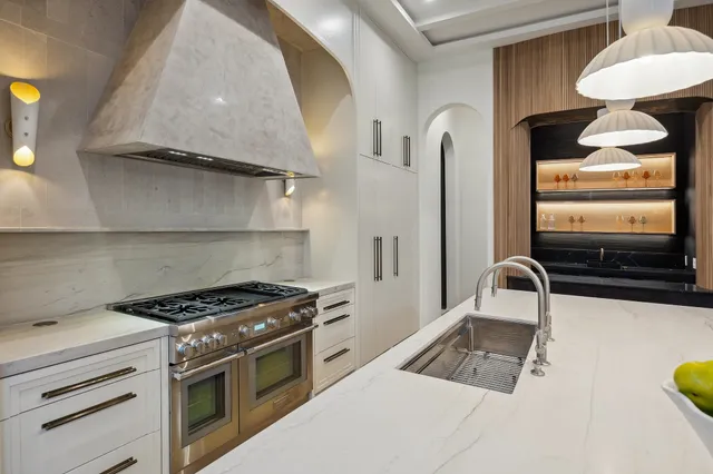 a kitchen with a dining table and chairs