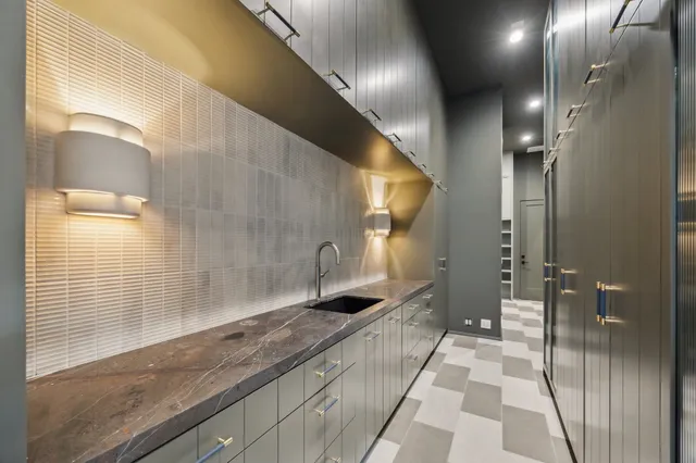 a swimming pool with potted plants