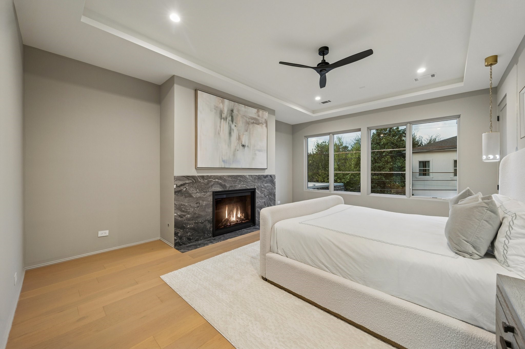 1656 Banks Street Houston, TX 77006 - Photo 21 of 31 a large white bed sitting in a room next to a window