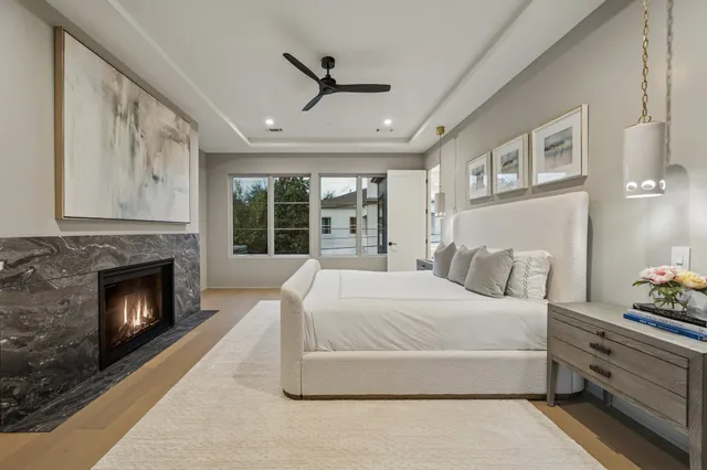 a bedroom with a bed and a fireplace