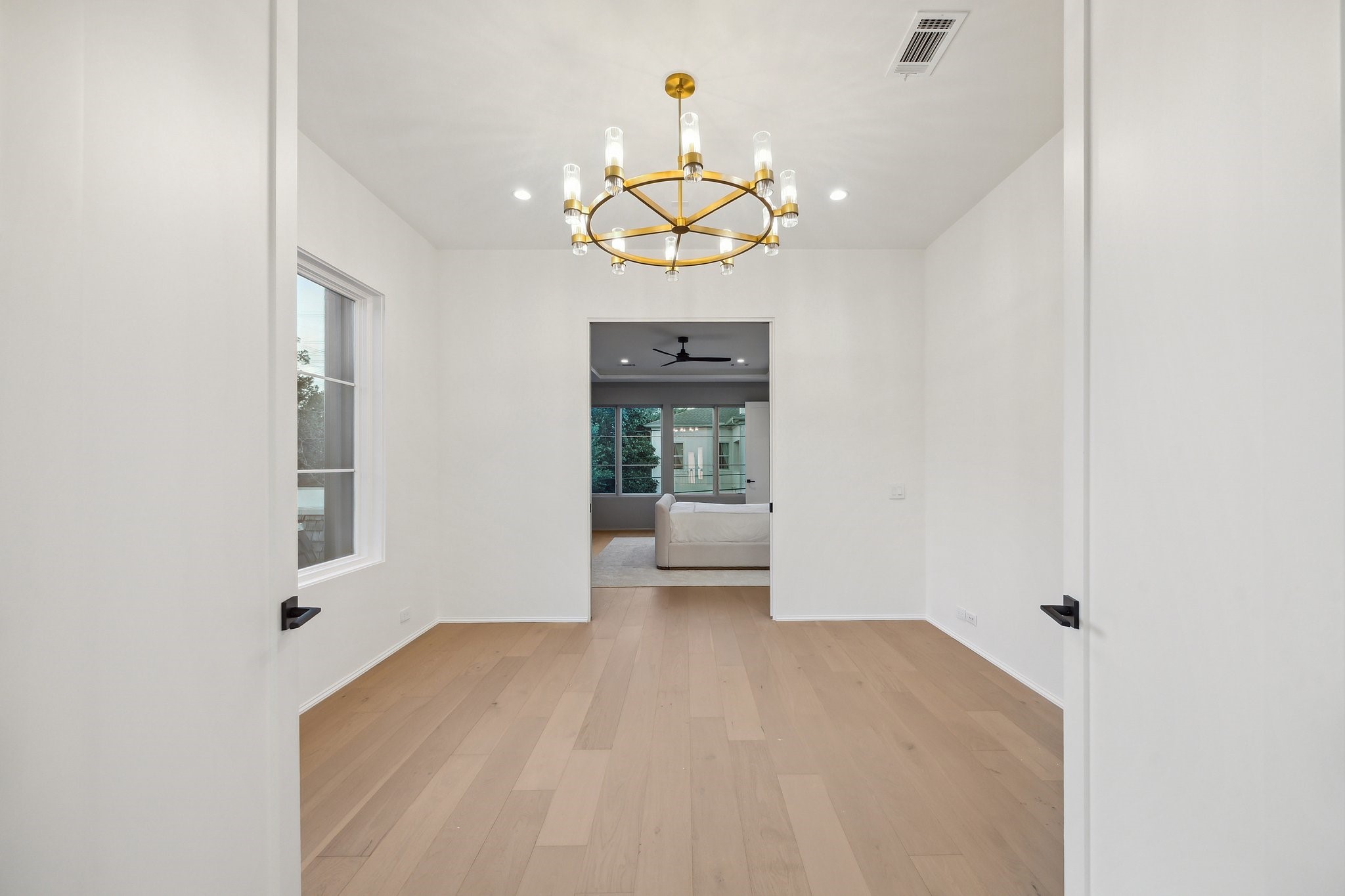 1656 Banks Street Houston, TX 77006 - Photo 23 of 31 a view of a living room with a chandelier