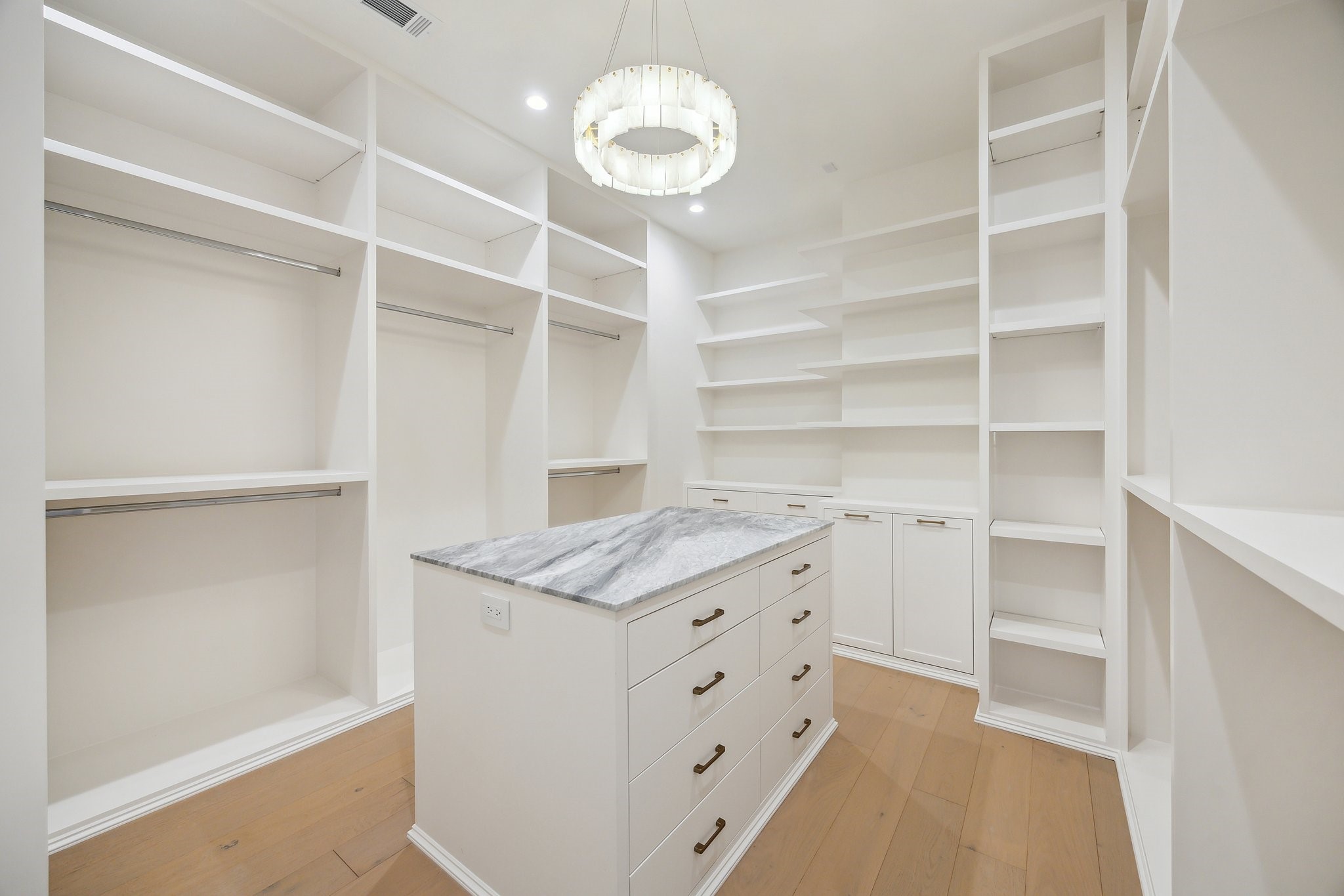 1656 Banks Street Houston, TX 77006 - Photo 24 of 31 a kitchen with a cabinets and chandelier