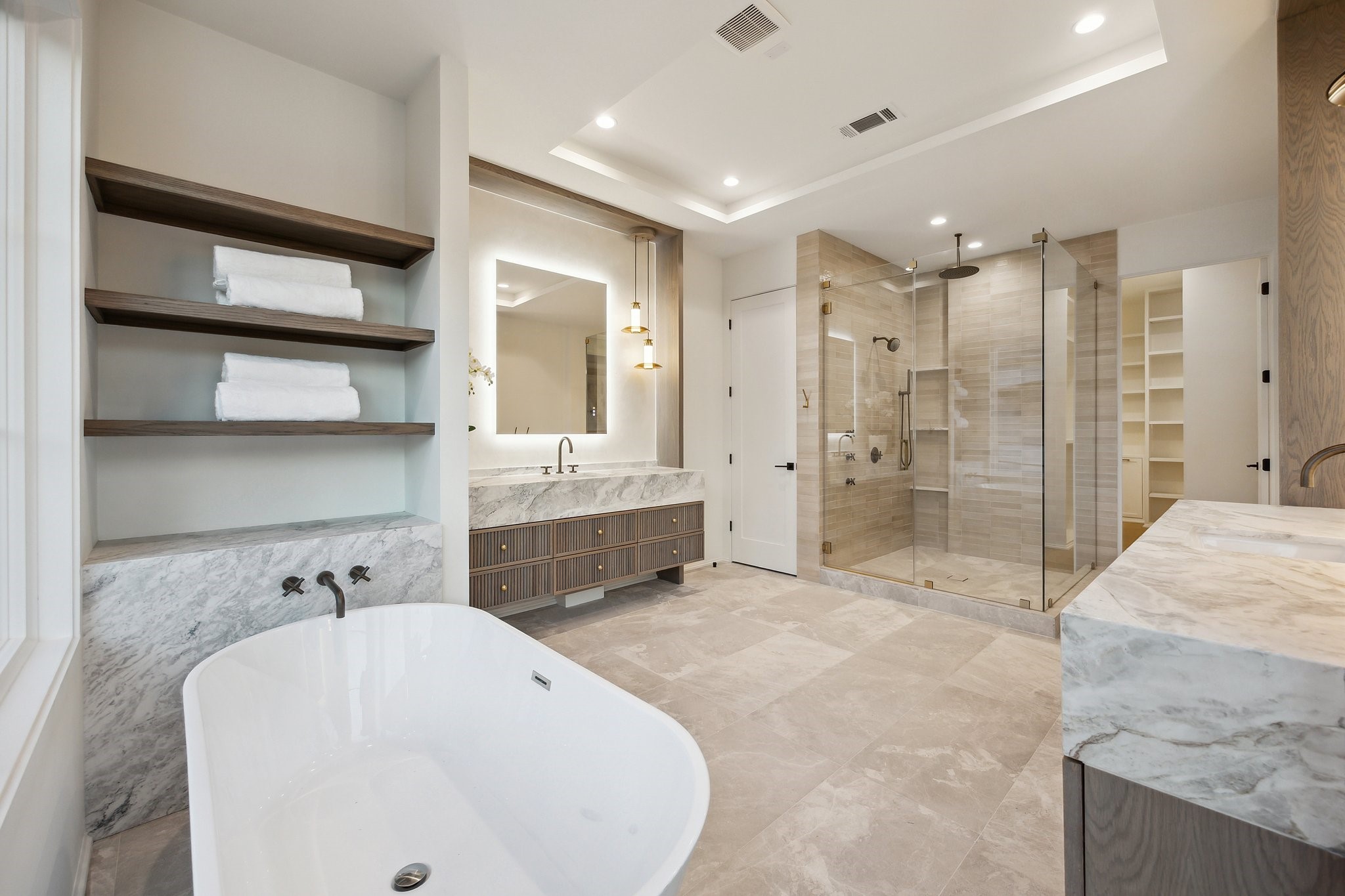 1656 Banks Street Houston, TX 77006 - Photo 26 of 31 a large white bathroom with a granite countertop sink mirror and shower
