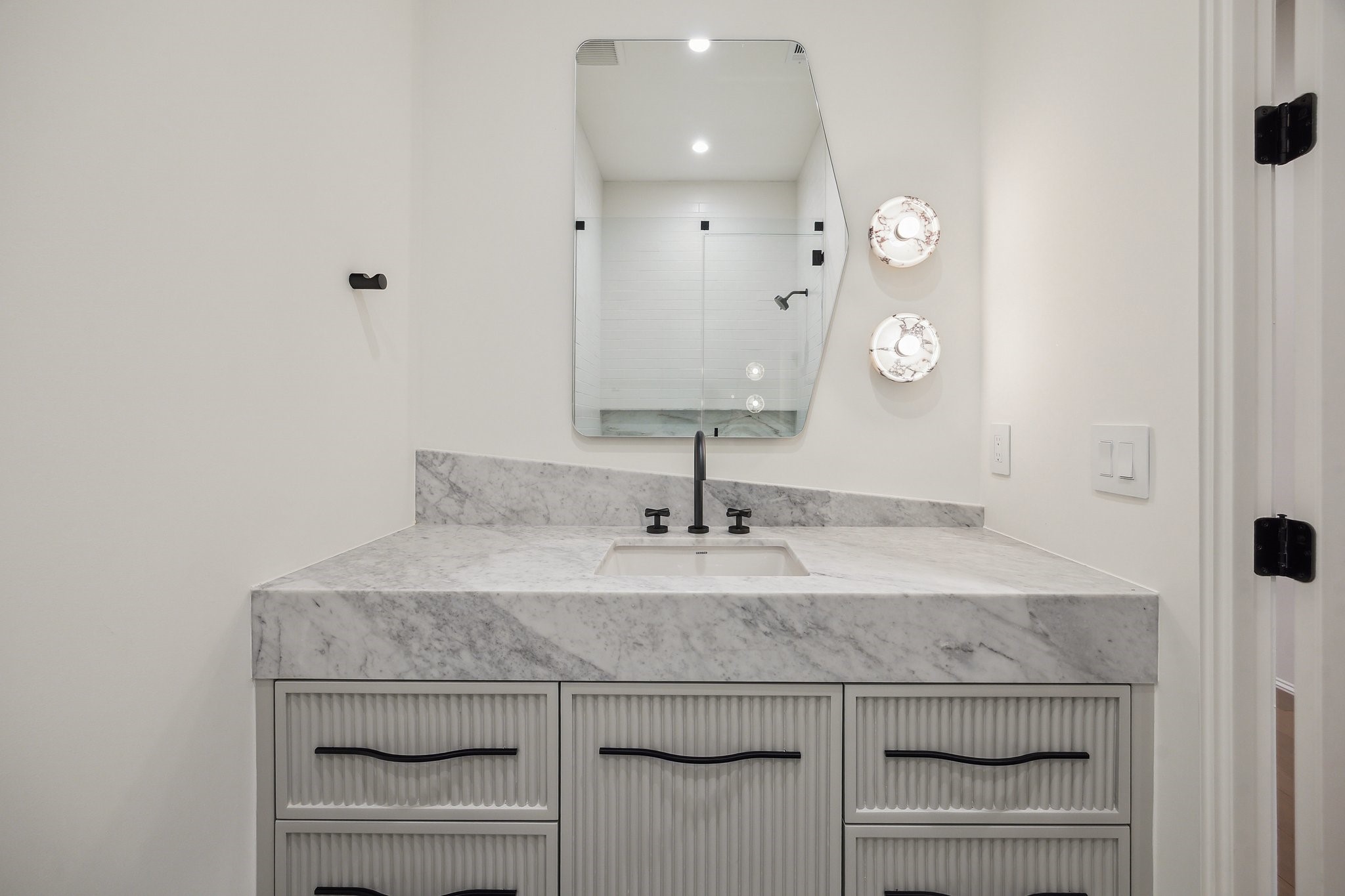 1656 Banks Street Houston, TX 77006 - Photo 29 of 31 a bathroom with a granite countertop sink a toilet and a mirror