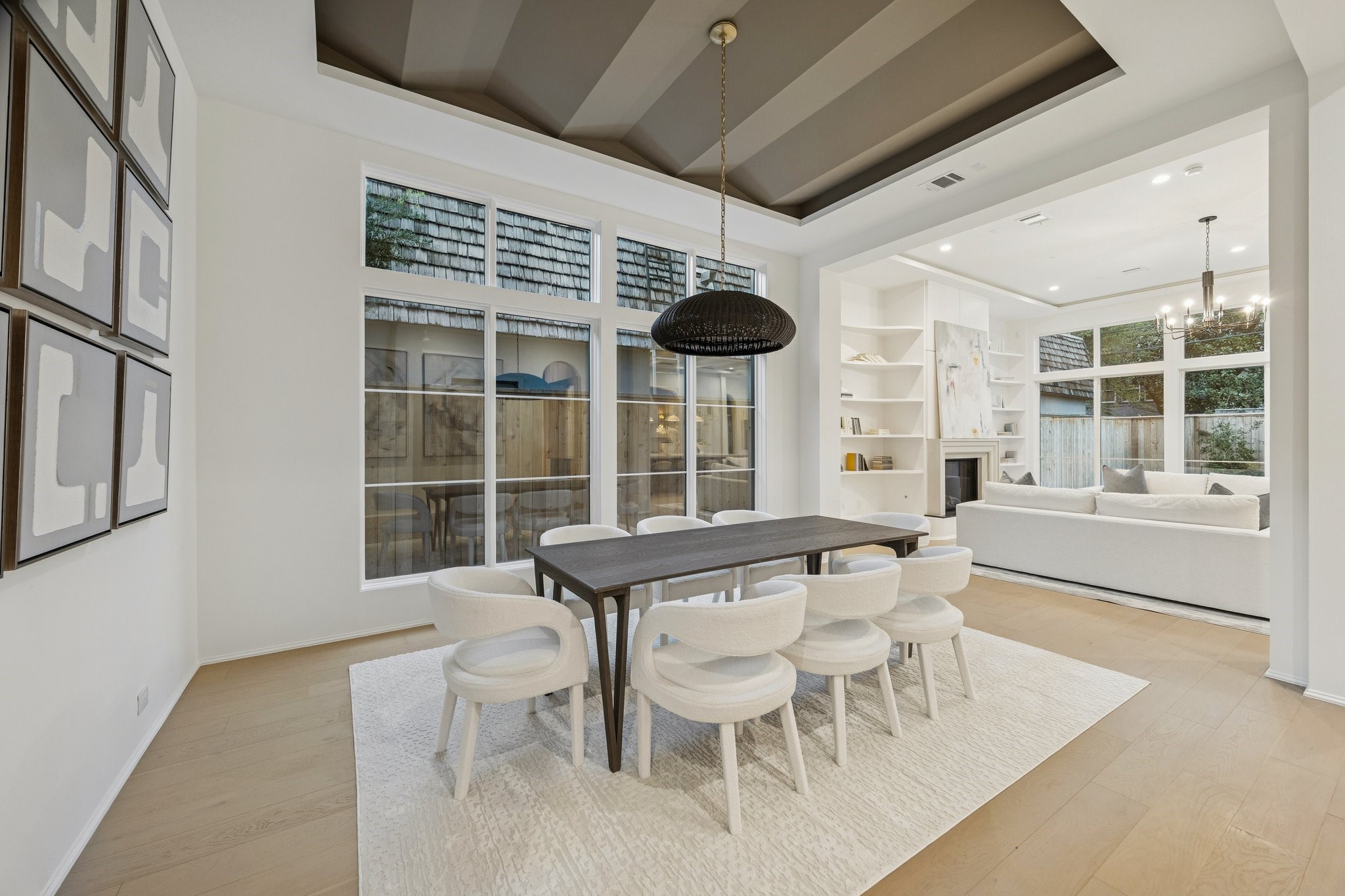 1656 Banks Street Houston, TX 77006 - Photo 10 of 31 a view of a dining room with furniture large windows and wooden floor