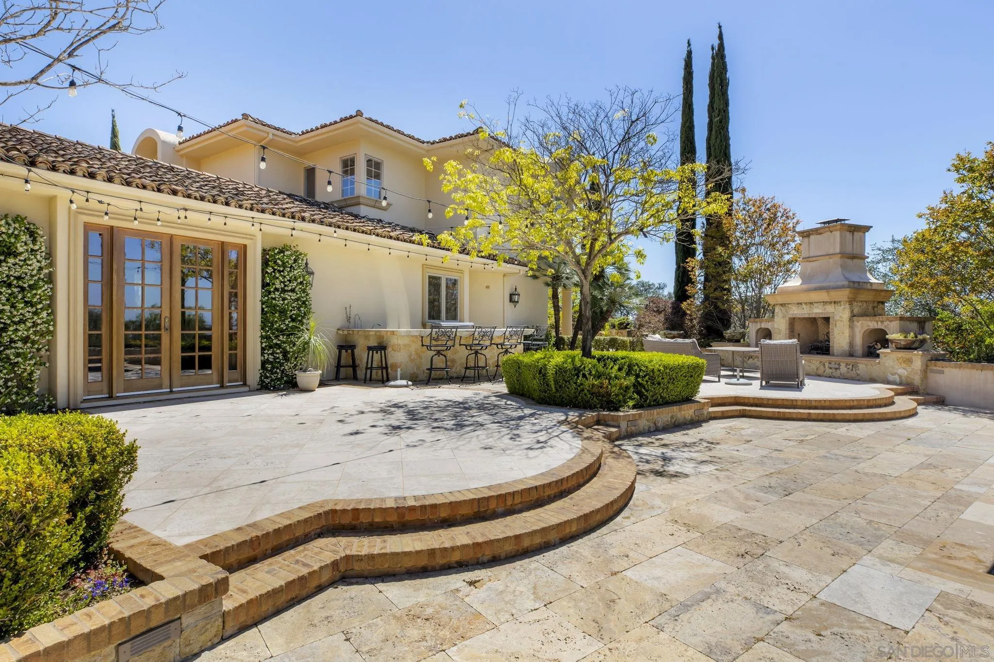 14440 Ridge Ranch Road Valley Center, CA 92082 - Photo 56 of 73 a view of a white house with a small yard and plants