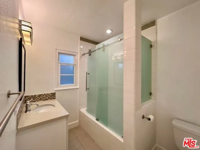 a view of a yard with potted plants