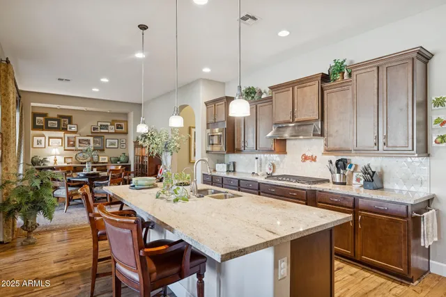 a dining room with furniture and wooden floor