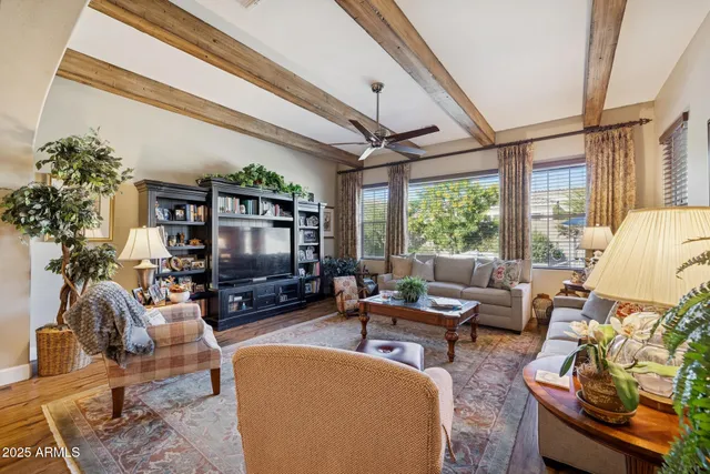 a spacious bathroom with a tub sink and mirror