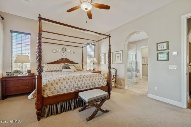 a front view of a house with swimming pool having outdoor seating