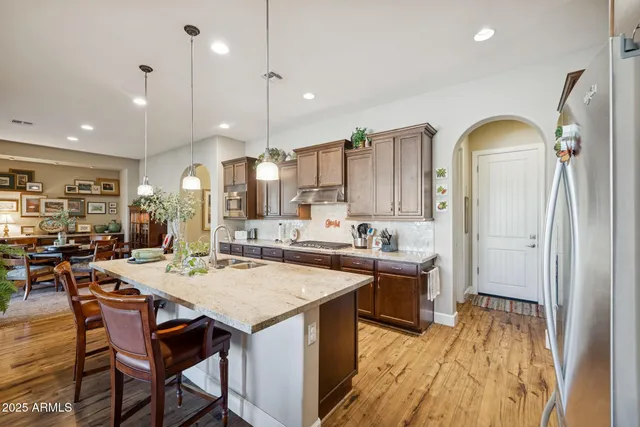 a view of a dining room with furniture and a window