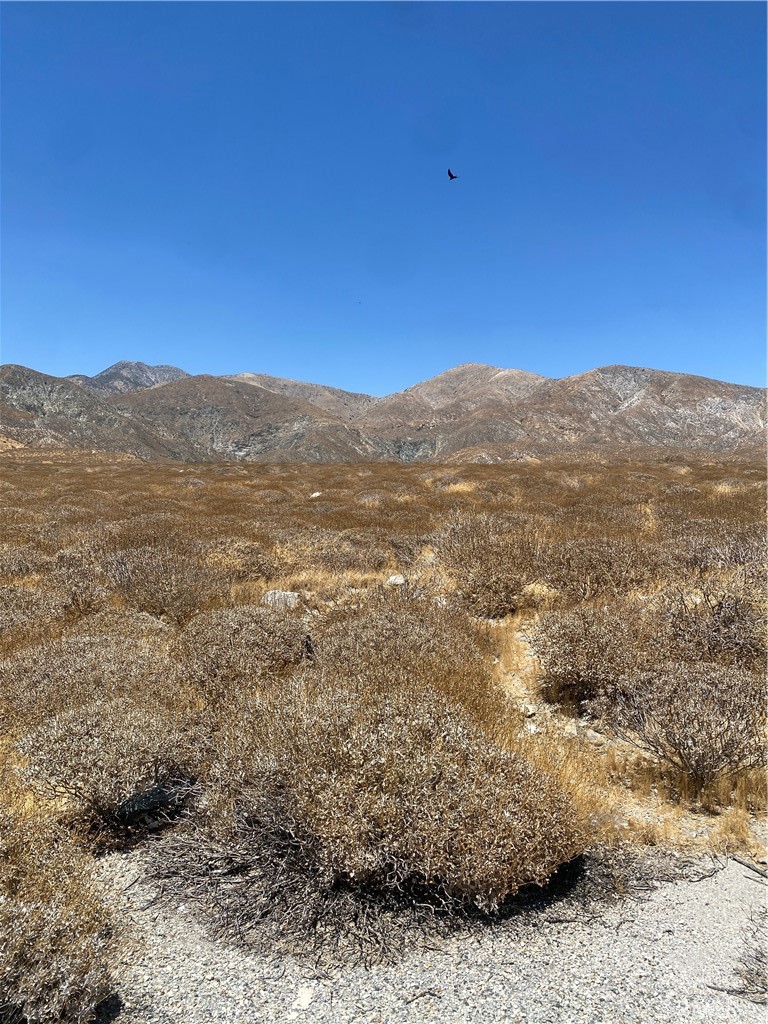 0 Mint Drive Whitewater, CA 92282 - Photo 1 of 1 a view of a mountain range in a cloudy sky