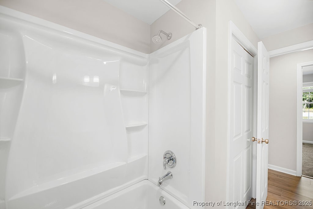 4066 Hummingbird Place Fayetteville, NC 28312 - Photo 18 of 30 a bathroom with a bathtub and a shower