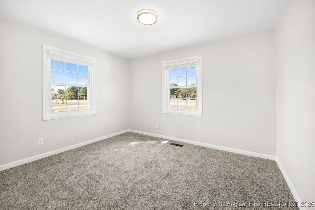 4066 Hummingbird Place Fayetteville, NC 28312 - Photo 19 of 30 an empty room with a window