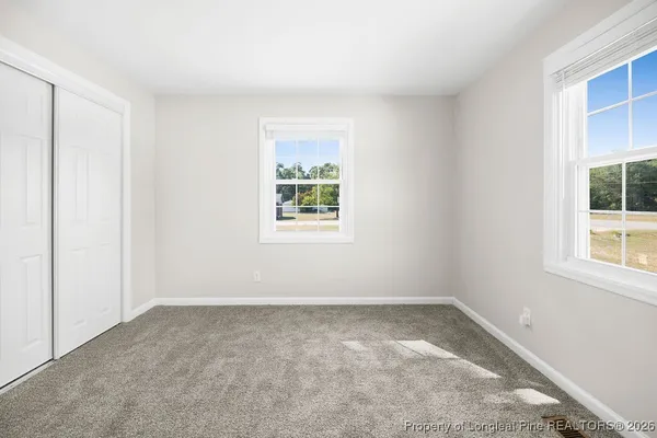 an empty room with windows