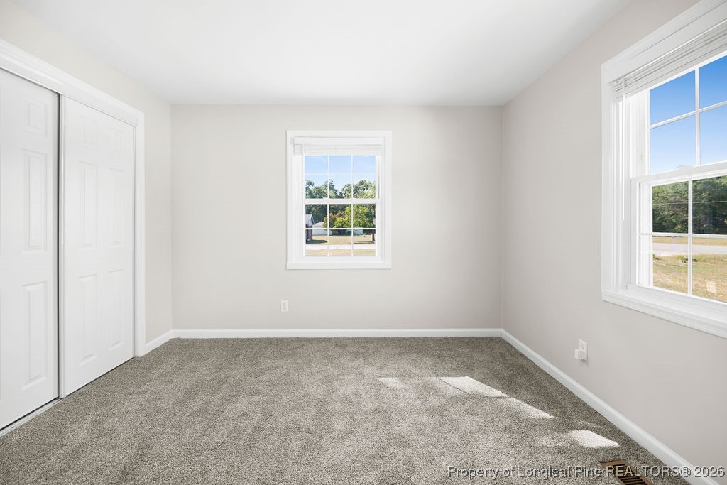 4066 Hummingbird Place Fayetteville, NC 28312 - Photo 20 of 30 an empty room with windows