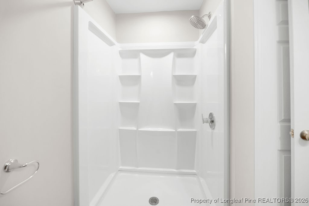 4066 Hummingbird Place Fayetteville, NC 28312 - Photo 26 of 30 a bathroom with a bathtub