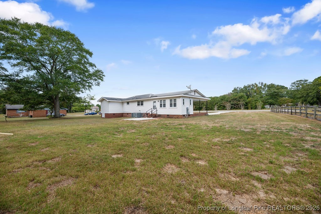 4066 Hummingbird Place Fayetteville, NC 28312 - Photo 28 of 30 a view of a house with a yard