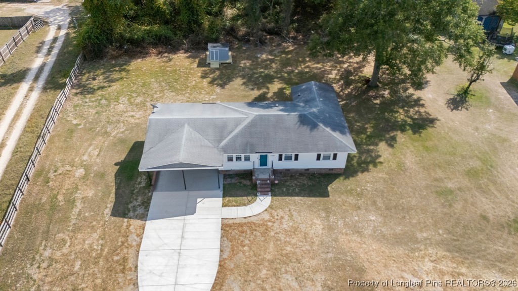 4066 Hummingbird Place Fayetteville, NC 28312 - Photo 4 of 30 a aerial view of a house with a yard and large tree