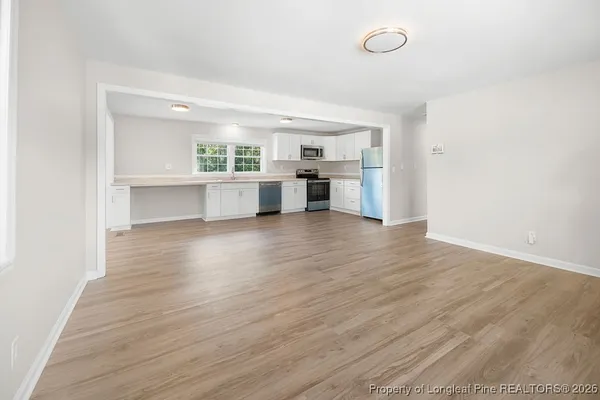 a view of cabinets and wooden floor