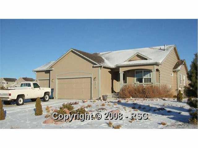 12416 Snaffle Bit Road Peyton, CO 80831 - Photo 1 of 14