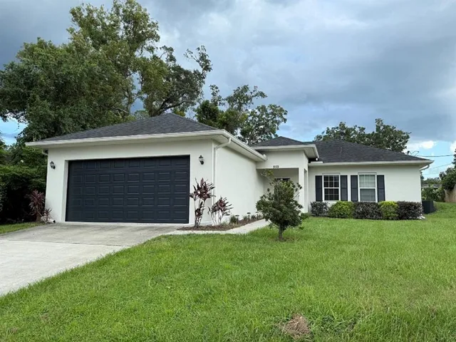 front view of a house with a yard