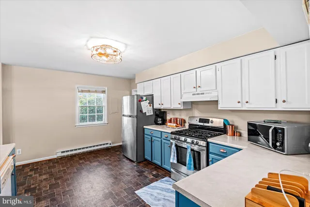 a kitchen with sink and cabinets