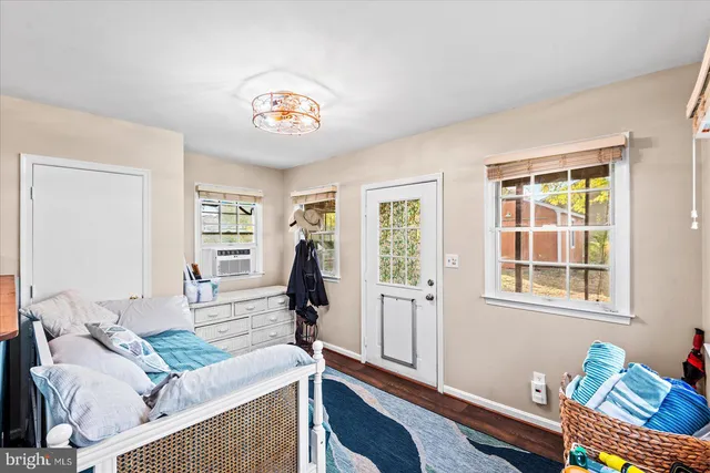 a bedroom with furniture and a window