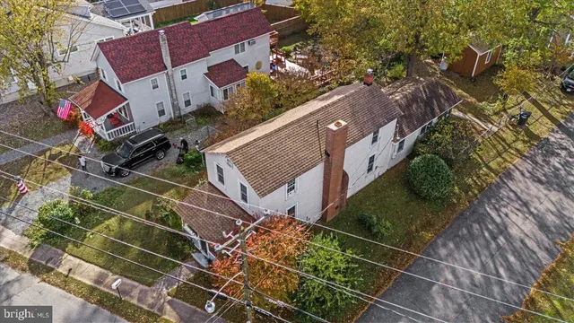 an aerial view of a houses with ocean view