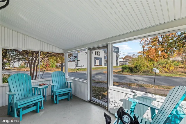 a living room with furniture window and wooden floor
