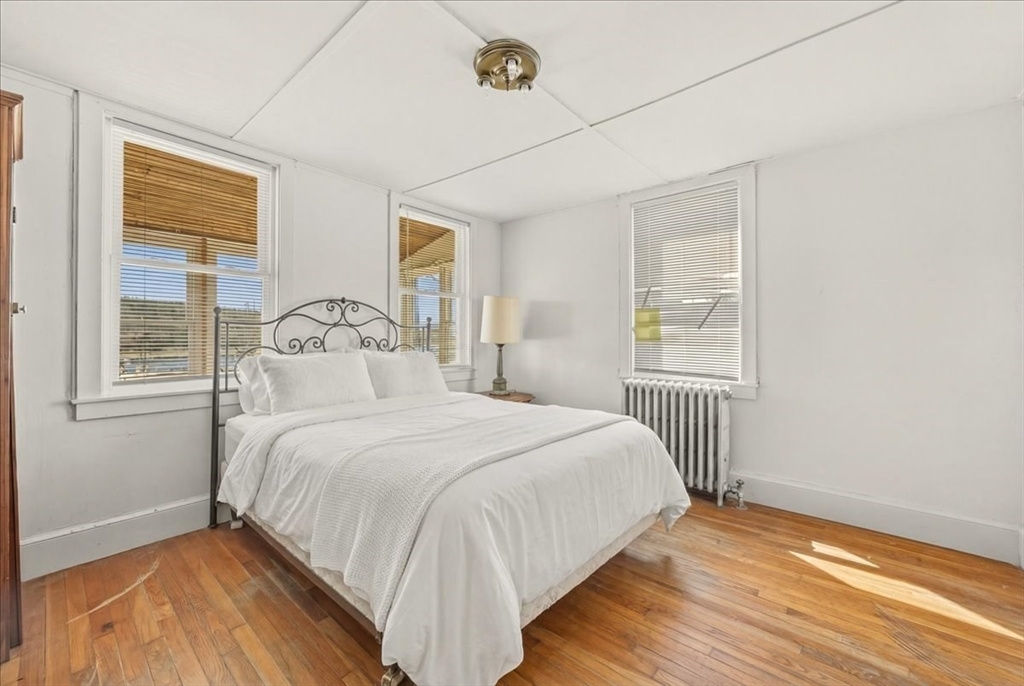 8 Herring Pond Road Bourne, MA 02532 - Photo 14 of 42 a bedroom with a bed and a window