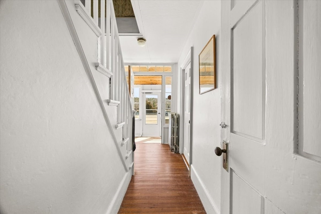 8 Herring Pond Road Bourne, MA 02532 - Photo 15 of 42 a view of a hallway with wooden floor and staircase