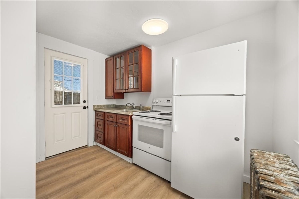 8 Herring Pond Road Bourne, MA 02532 - Photo 18 of 42 a kitchen with a refrigerator stove and a sink