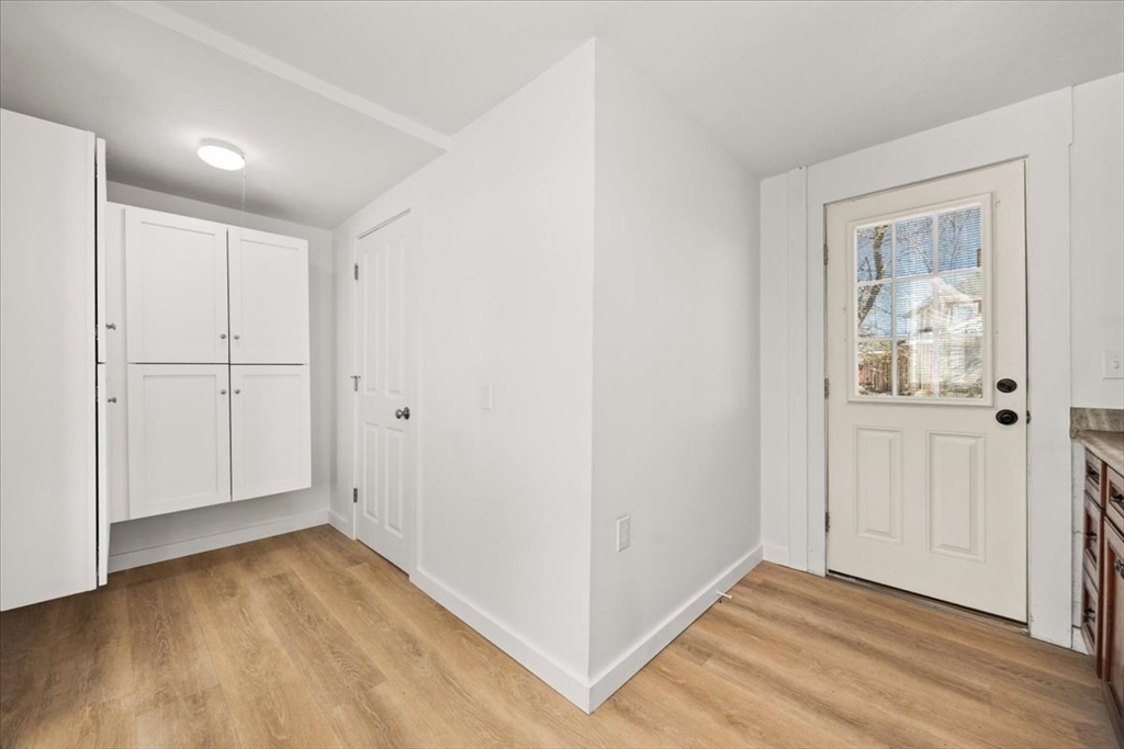 8 Herring Pond Road Bourne, MA 02532 - Photo 20 of 42 a view of an empty room with wooden floor