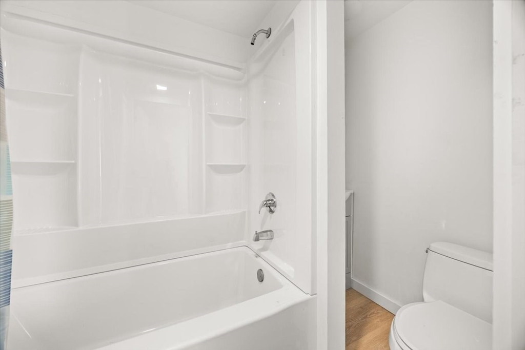 8 Herring Pond Road Bourne, MA 02532 - Photo 21 of 42 a white bath tub sitting next to a toilet