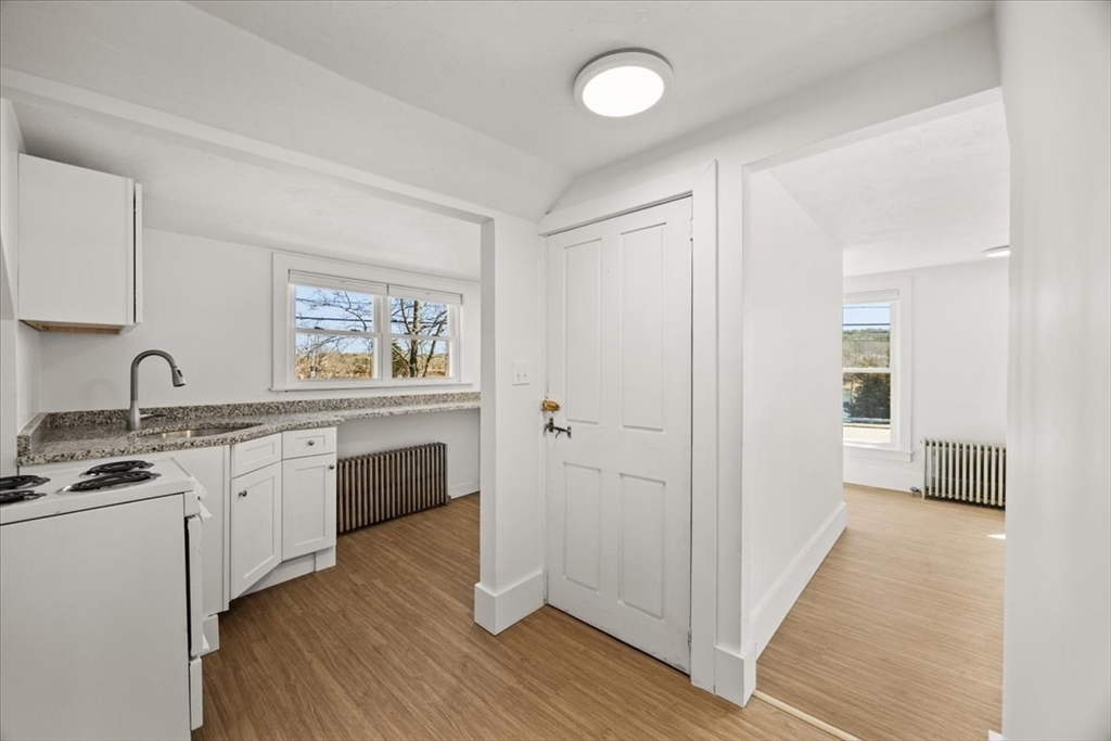 8 Herring Pond Road Bourne, MA 02532 - Photo 27 of 42 a view of a kitchen with a sink a refrigerator and window
