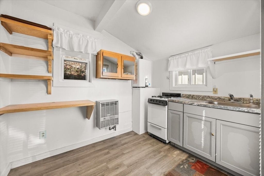 8 Herring Pond Road Bourne, MA 02532 - Photo 32 of 42 a kitchen with stainless steel appliances granite countertop a stove and a sink