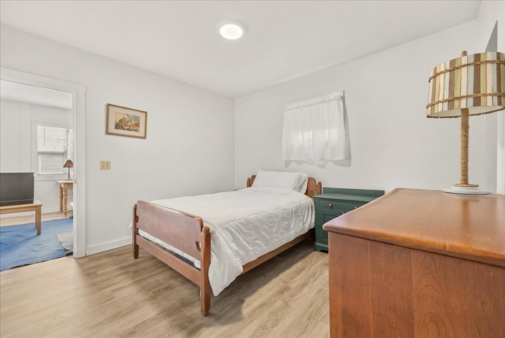 8 Herring Pond Road Bourne, MA 02532 - Photo 36 of 42 a bed room with a bed and a table