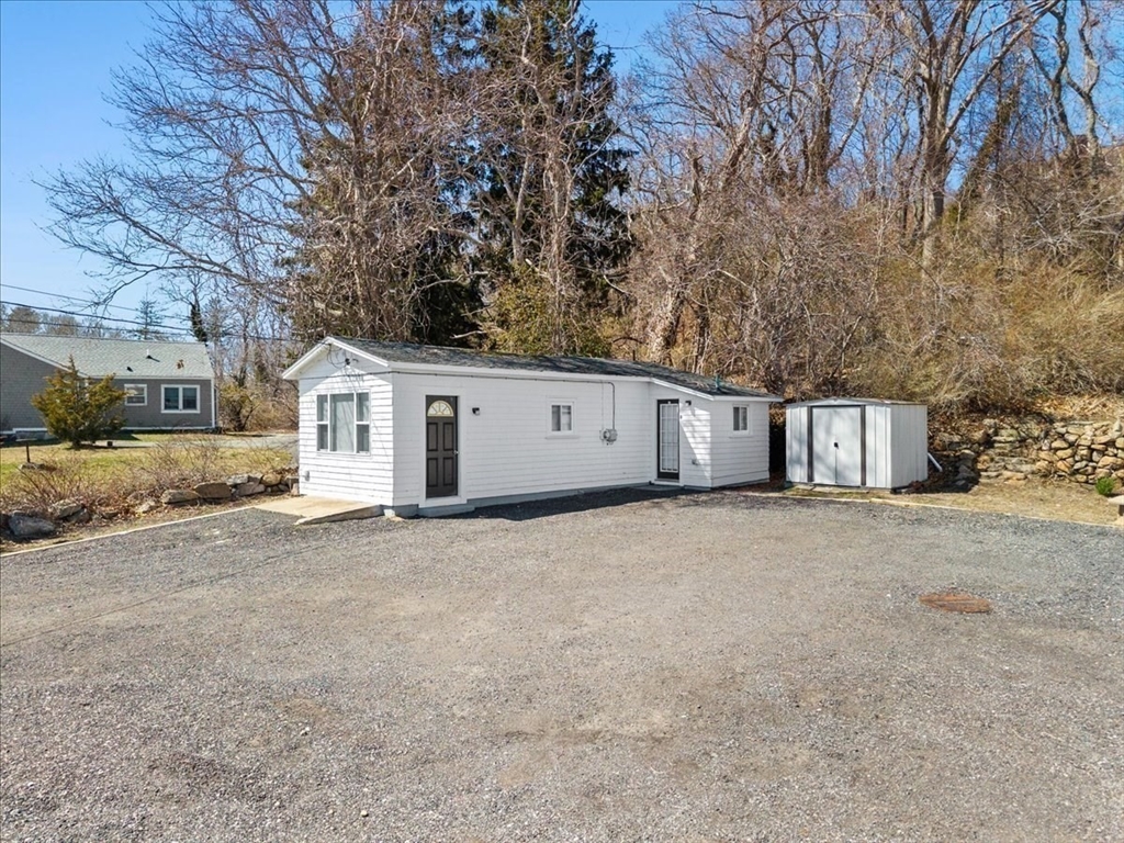 8 Herring Pond Road Bourne, MA 02532 - Photo 5 of 42 a view of a house with a yard and garage