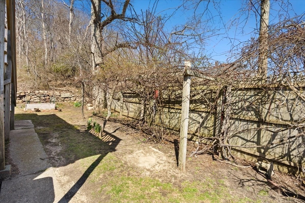 8 Herring Pond Road Bourne, MA 02532 - Photo 10 of 42 a view of yard along with trees