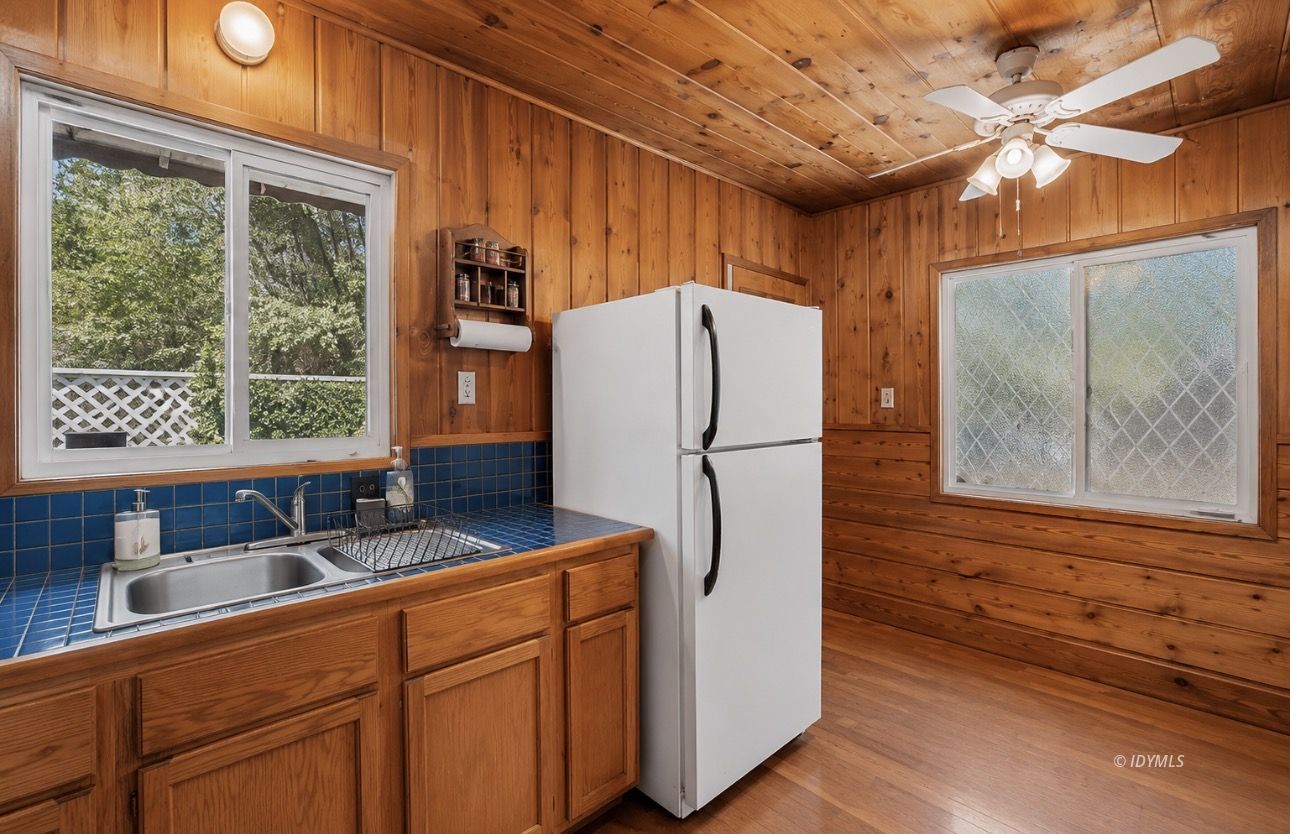 53480 Tollgate Road Idyllwild, CA 92549 - Photo 10 of 26 a kitchen with stainless steel appliances a refrigerator and a sink