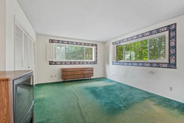 a view of room with window and hallway