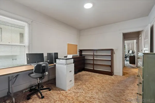 a view of a workspace with furniture
