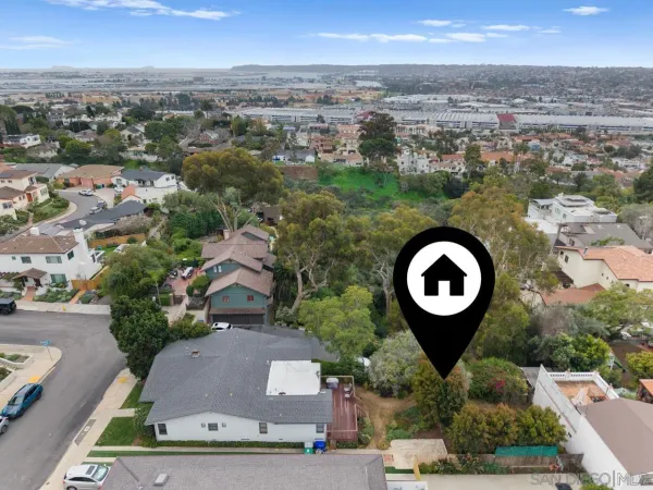 an aerial view of a house with outdoor space